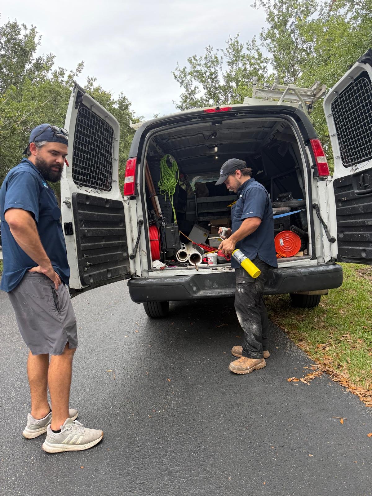 A&L Premier Plumbing technicians loading drain cleaning equipment in Miramar, FL