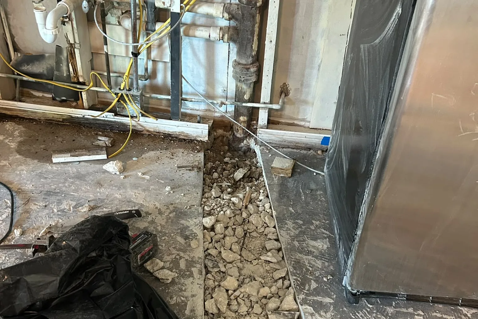 Cast iron drain pipe exposed during a plumbing replacement in Miramar